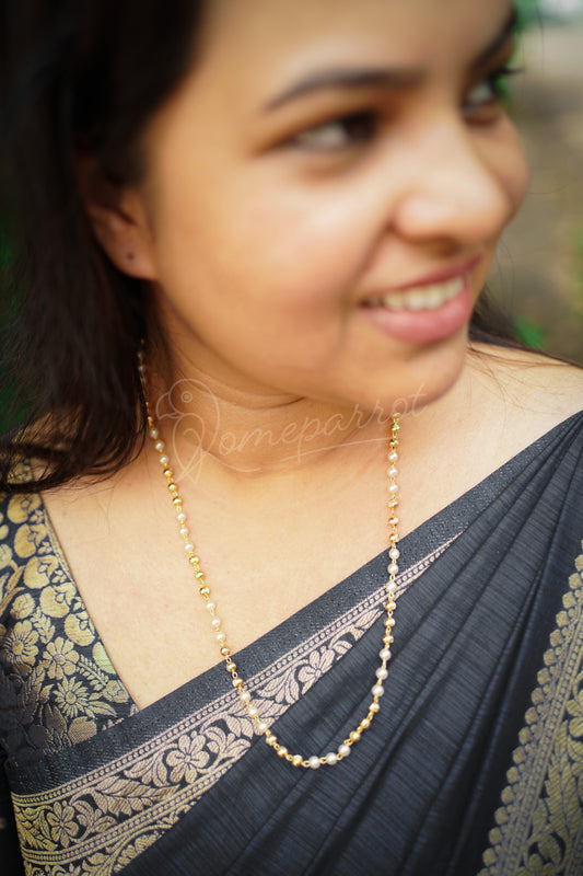 Long gold & white beaded chain